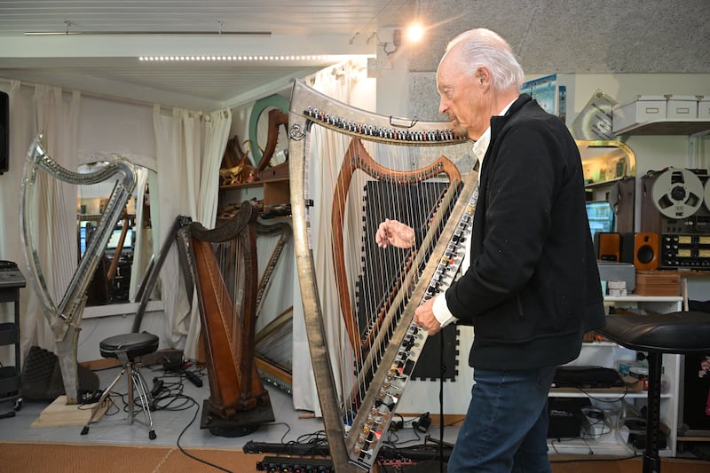 Alan Stivell with his electro-acoustic harp in his studio in Britanny. Photograph: Damien Meyer/AFP via Getty