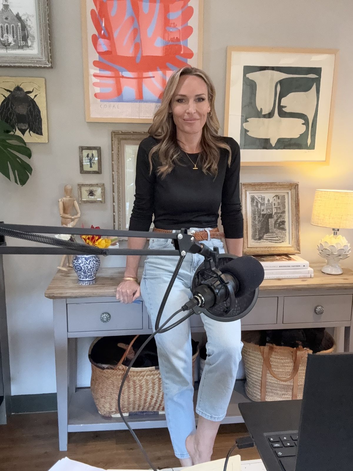 isabel webster doing podcast in jeans and black top