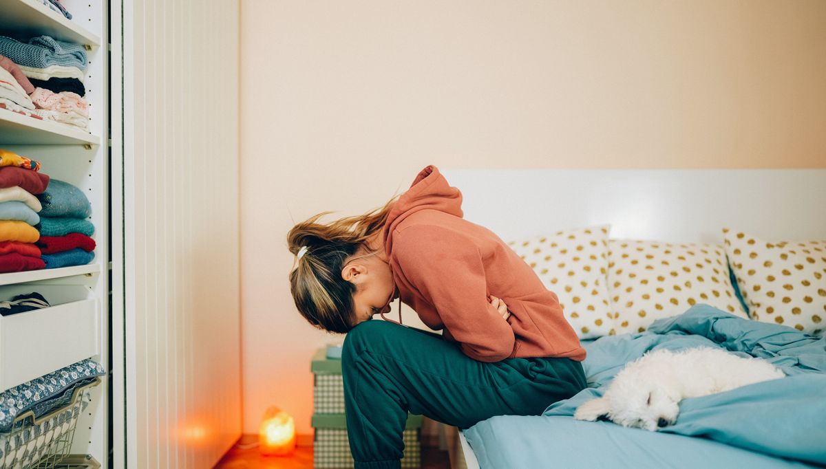 Person experiencing norovirus symptoms