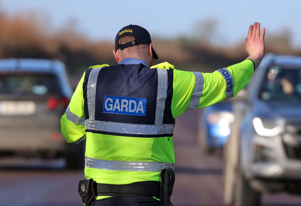 A Garda wearing the new Garda baseball cap conducts a checkpoint on January 3, 2025