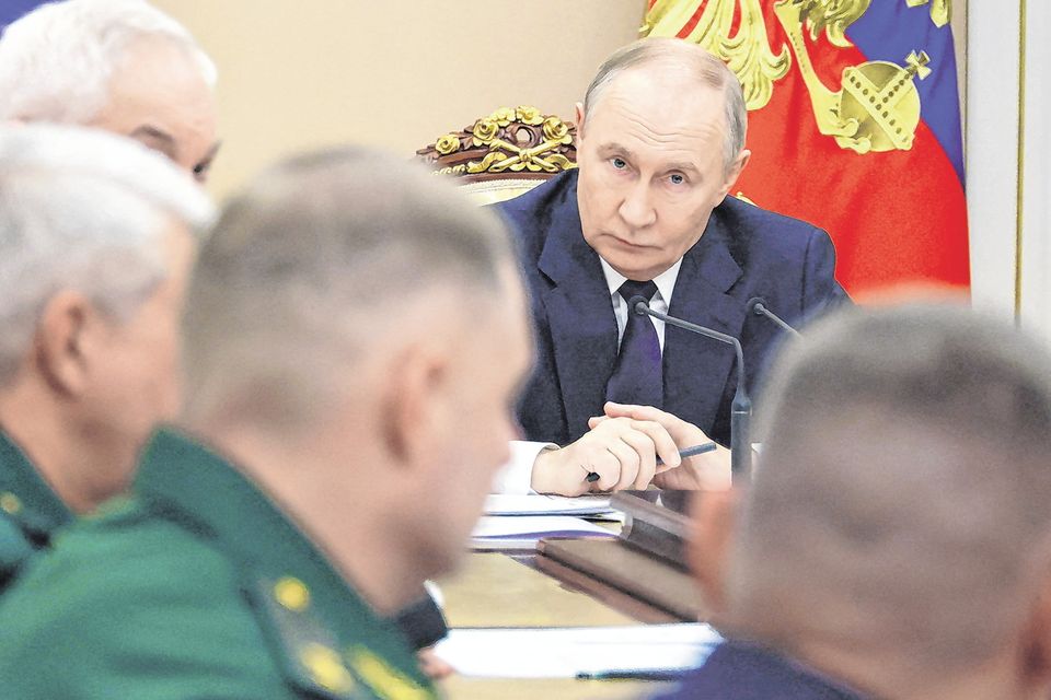 Russian President Vladimir Putin chairs a meeting on the Ukraine war in Moscow. Photo: Sputnik via Reuters