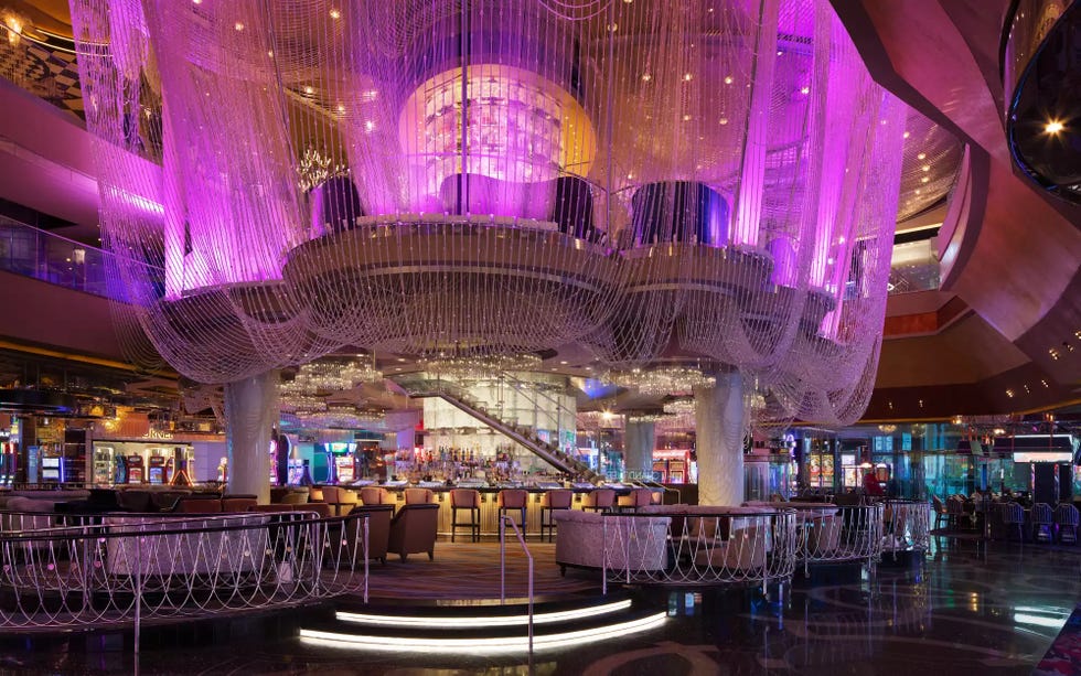 Luxurious casino interior with vibrant lighting and seating arrangements