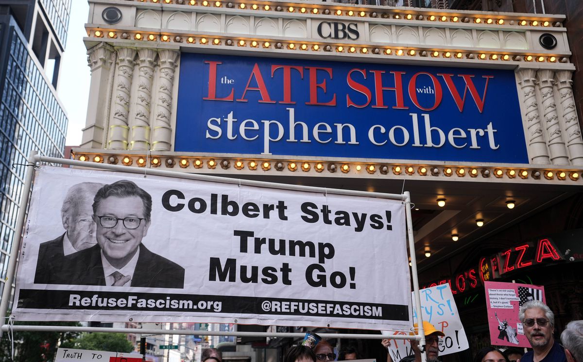 New York, USA - JULY 21: Dozens of anti-Trump protesters gathered outside the Ed Sullivan Theater, home of The Late Show with Stephen Colbert, to protest CBS's reported decision to fire the longtime host. Demonstrators held signs and chanted in support of Colbert, blaming political pressure and criticizing the network's move as a blow to free speech and satire. The protest came shortly after rumors surfaced that Colbert's termination was linked to his outspoken criticism of President Donald Trump. (Photo by Lokman Vural Elibol/Anadolu via Getty Images)