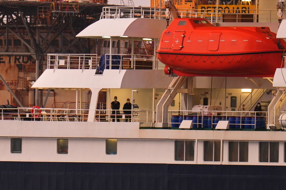 Passengers on board the hantavirus-stricken cruise ship MV Hondius after arriving at the port of Granadilla in Tenerife on Sunday (Manu Fernandez/AP)