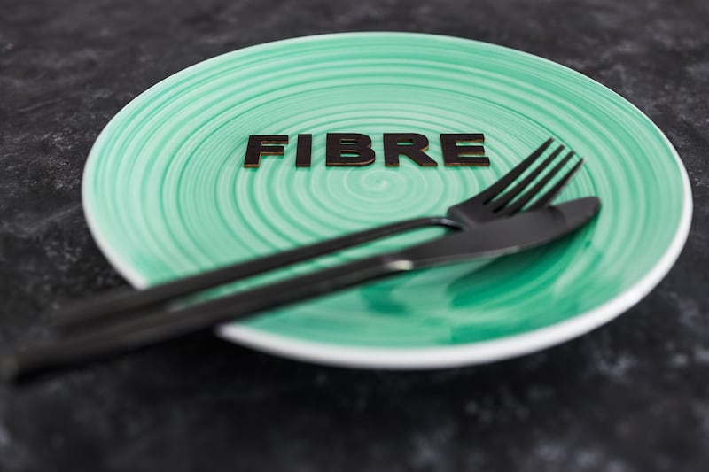 Fibre text on dining plate with fork and knife