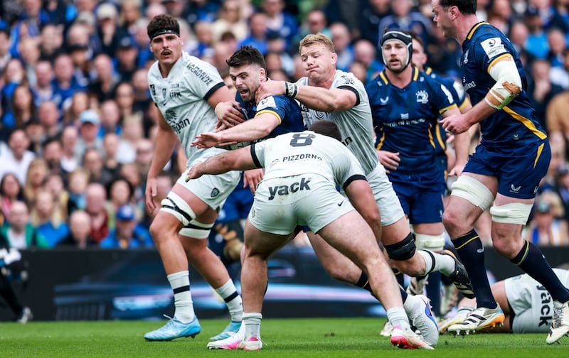 Leinster’s Harry Byrne tackled by Toulon’s David Ribbans and Mikheil Shioshvili. Photograph: Nick Elliott/Inpho