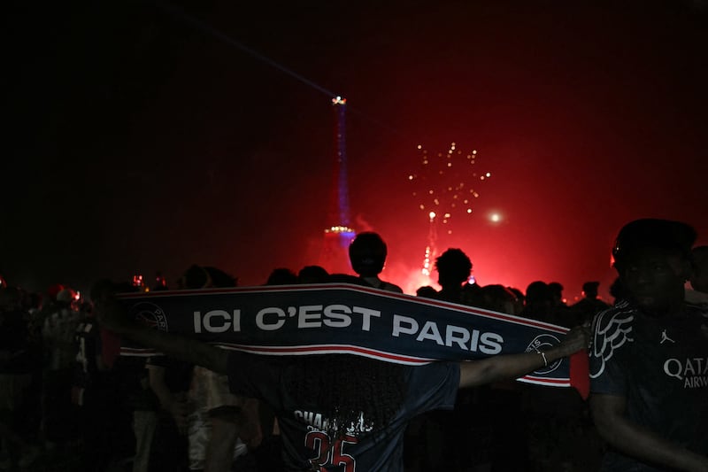 PSG supporters at Place du Trocadéro opposite the Eiffel Tower. Photograph: Lou Benoist/AFP via Getty Images
