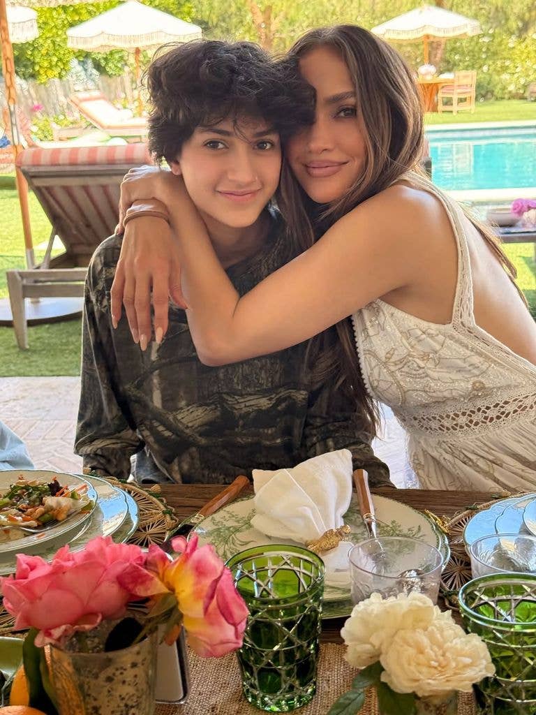 photo of jennifer lopez hugging child emme
