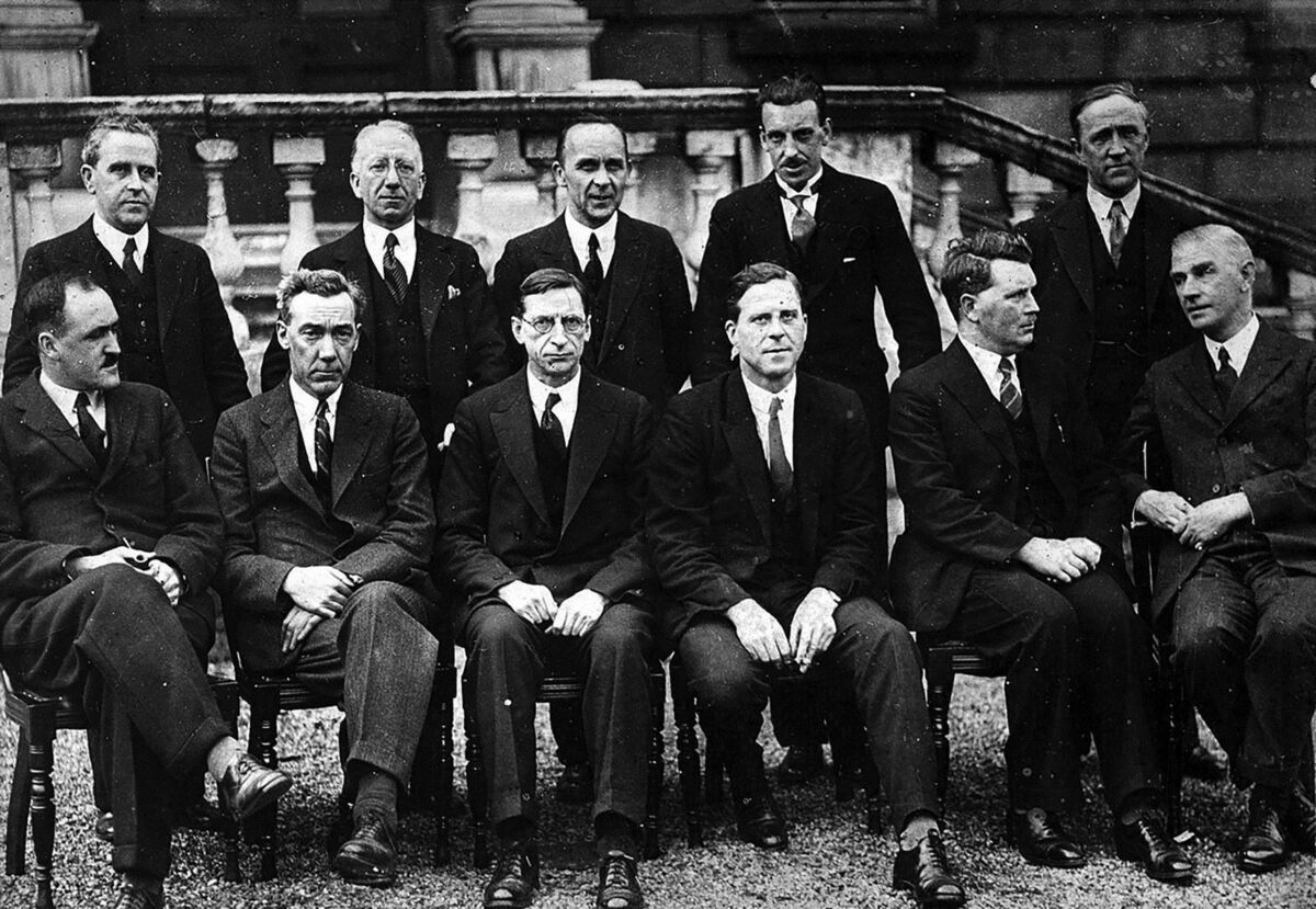 The first Fianna Fáil cabinet in 1932. Standing left to right: Seán MacEntee, Seán T. O’Kelly, Joseph Connolly, Seán Lemass, Gerald Boland. Sitting left to right: Frank Aiken, P.J. Ruttledge, Éamon de Valera, James Ryan, Thomas Derrig, James Geoghegan. 