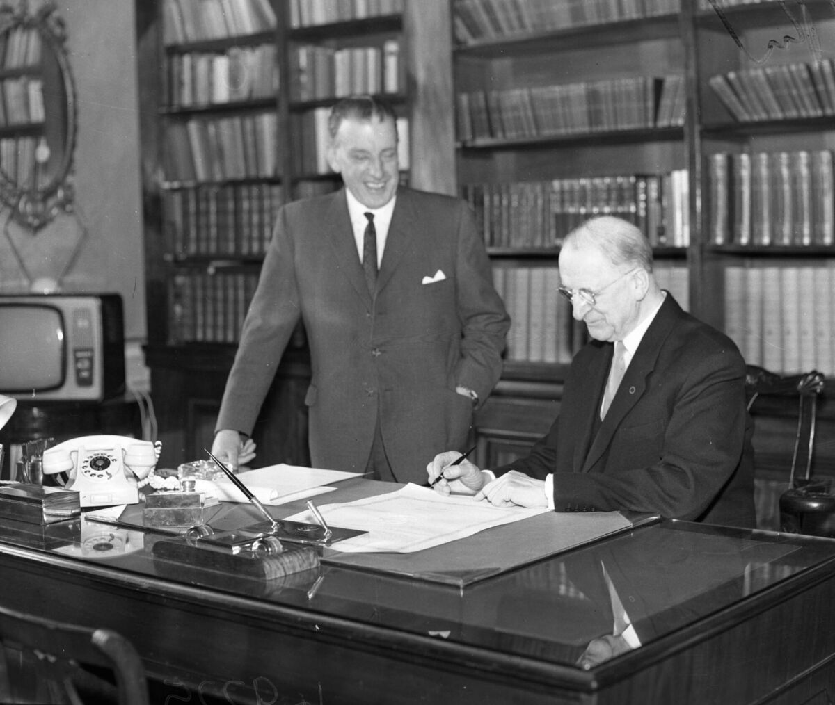 Taoiseach Sean Lemass and President de Valera signing the proclamation to dissolve Dáil Éireann in 1965. File photo: Independent News And Media/Getty Images