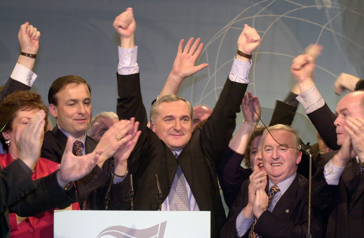 Bertie Ahern cheered by his front bench at his party's ard fheis in 2000. With him are Mary O Rourke, Dick Roche, Micheal Martin. Photo: RollingNews.ie