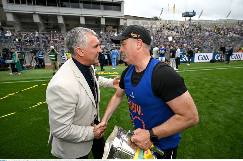 Tipperary manager Liam Cahill is congratulated by former Tipperary manager Liam Sheedy after the 2025 All-Ireland hurling final. Pic: Stephen McCarthy/Sportsfile