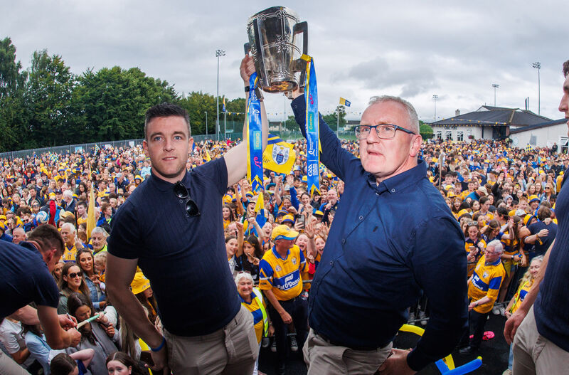 Clare captain Tony Kelly and manager Brian Lohan lift the Liam McCarthy cup after winning the 2024 All-Ireland hurling final. Pic: ©INPHO/Tom Maher