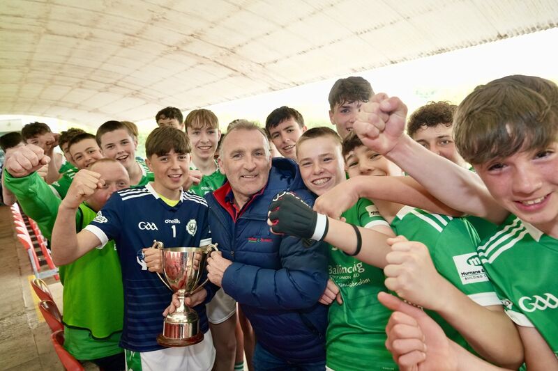 Ballincollig captain John Kearney and his teammates accept the Premier 1 Féile title from Donal Hurley at MTU. Picture: Noel Sweeney