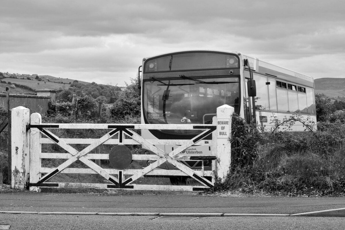 Blacklion and Belcoo station, with an Ulsterbus coach garaged behind the old level crossing gates on the border area of Northern Ireland and the Republic