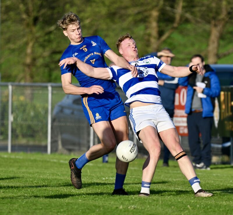 Midfielder Thomas Egan of St Finbarr's challenges for possession with Robbie Minihane of Castlehaven. Picture: Larry Cummins
