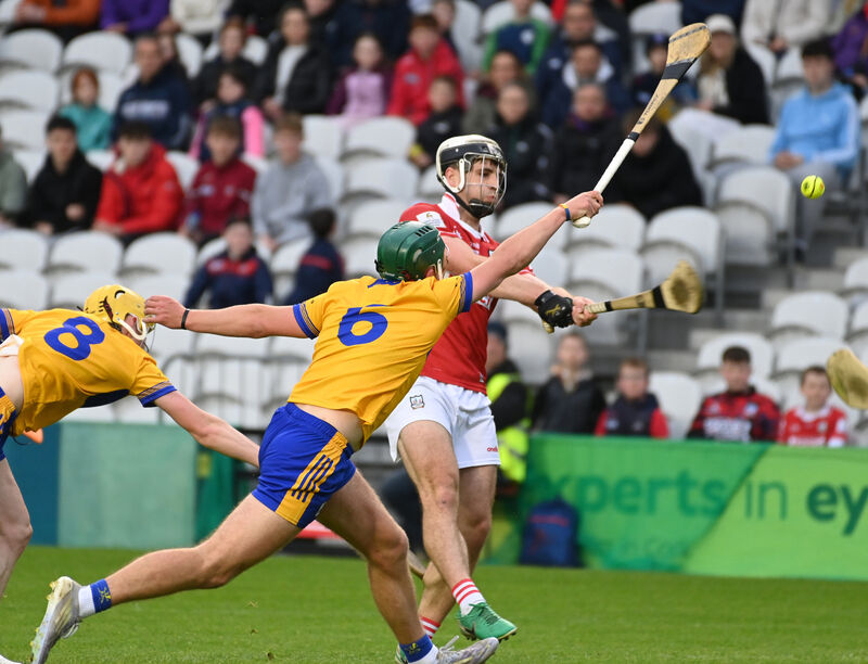 Cork's Barry Walsh shoots over a point from Clare's James Hegarty and Daniel Costello. Pic: Eddie O'Hare.