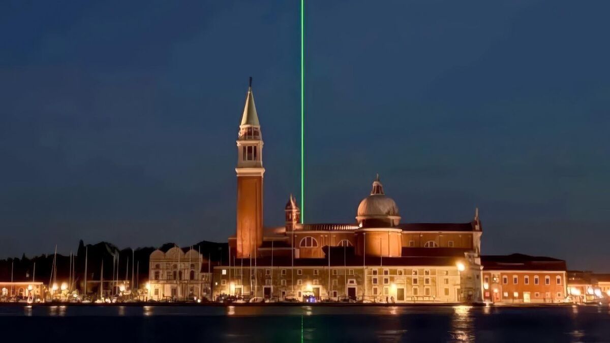 A laser penetrates the sky over Venice as part of the Biennale 2026. Picture: Chris Levine/PA Wire