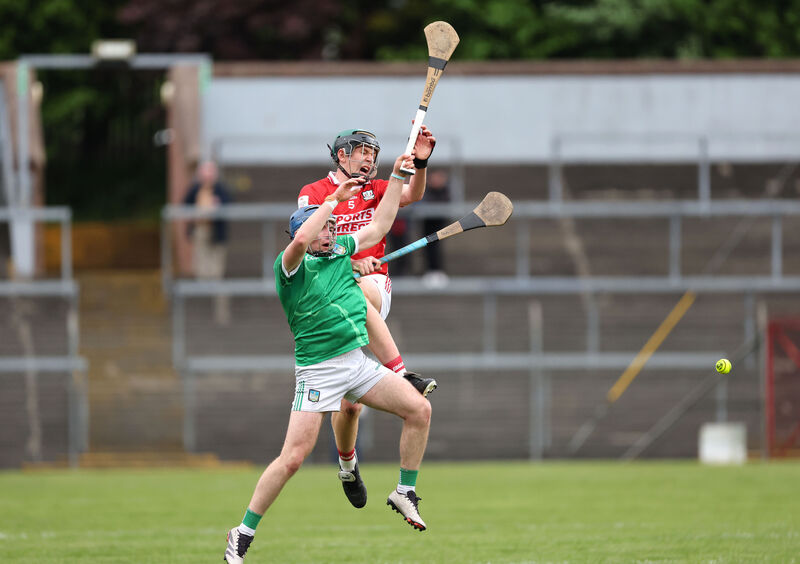  Eoin Considine of Cork and Shane Waters of Limerick contest aerial possession. Picture: Jim Coughlan