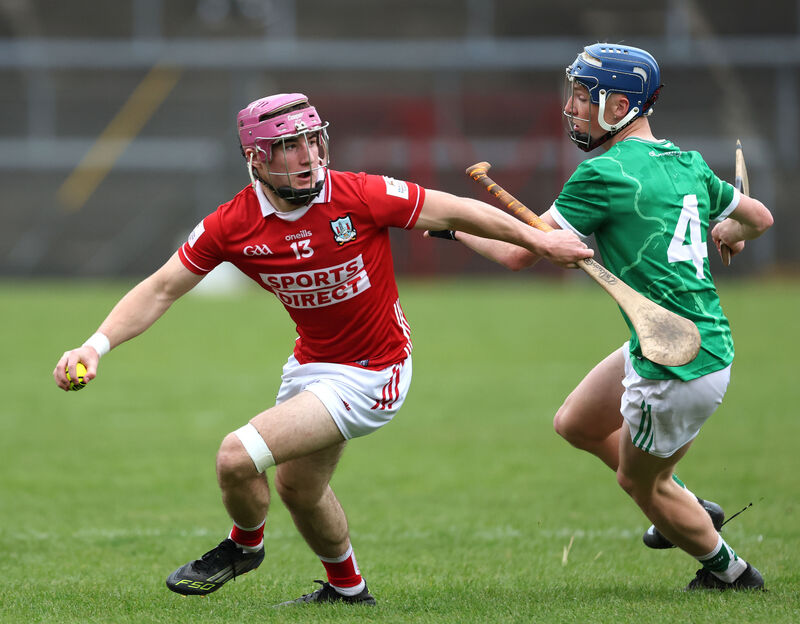 Cork's Callum Coffey looks to get away from Sam Mitchell of Limerick. Picture: Jim Coughlan