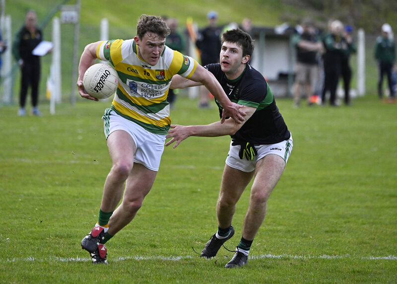 Carbery Rangers' Barry Kerr escapes the clutches of Luke Horgan of Nemo Rangers. Picture: Martin Walsh