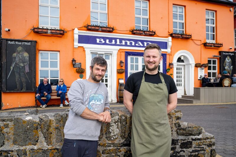 Brothers Mark and Donal Crosbie, co-owners of The Bulman Bar, pictured outside the historic pub in Summercove, Kinsale, overlooking the harbour. Picture: Chani Anderson