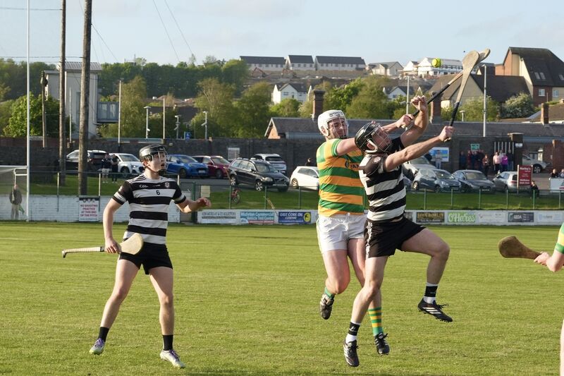 Midleton's Seán O’Sullivan and Kevin O’Keeffe under the dropping ball. Picture: Noel Sweeney