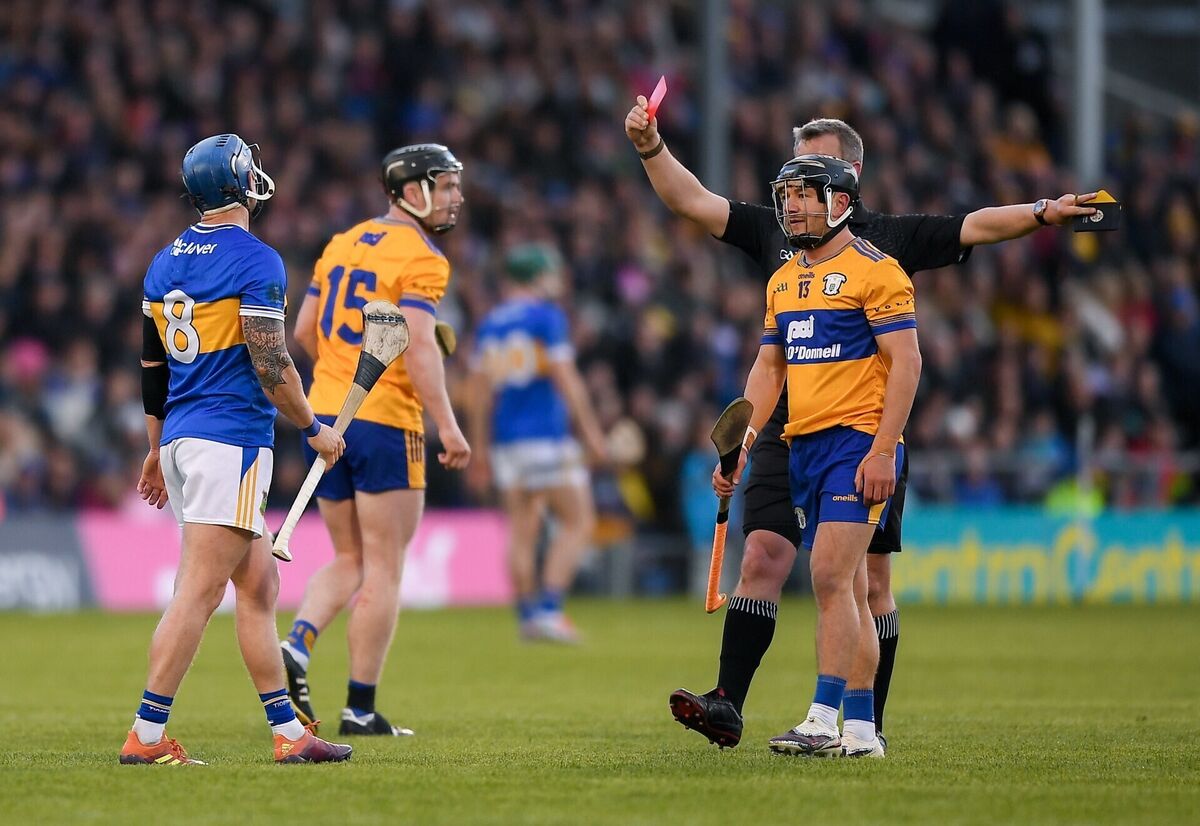 Willie Connors is shown a red card following his second yellow from referee Thomas Walsh. Pic: John Sheridan/Sportsfile