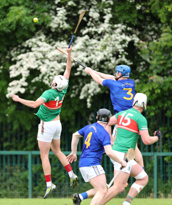  Jamie Burns, St Finbarr's rising high with Michael Wall, Fr O'Neill's. Picture: Jim Coughlan.
