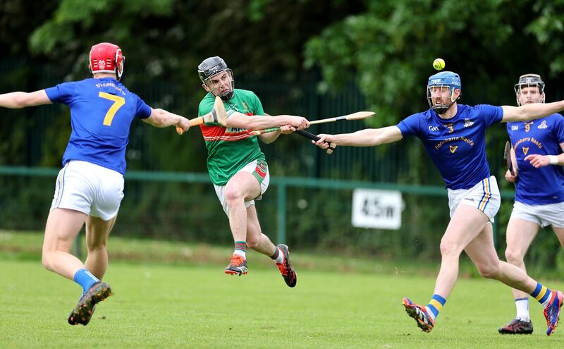  Thomas Egan and Jamie Burns, St Finbarr's, trying to block the shot of Kevin O'Sullivan. Picture: Jim Coughlan.