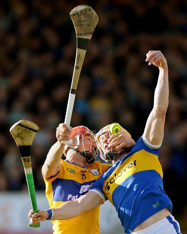 Clare's Peter Duggan wrestling with Ronan Maher of Tipperary. Picture: INPHO/Laszlo Geczo