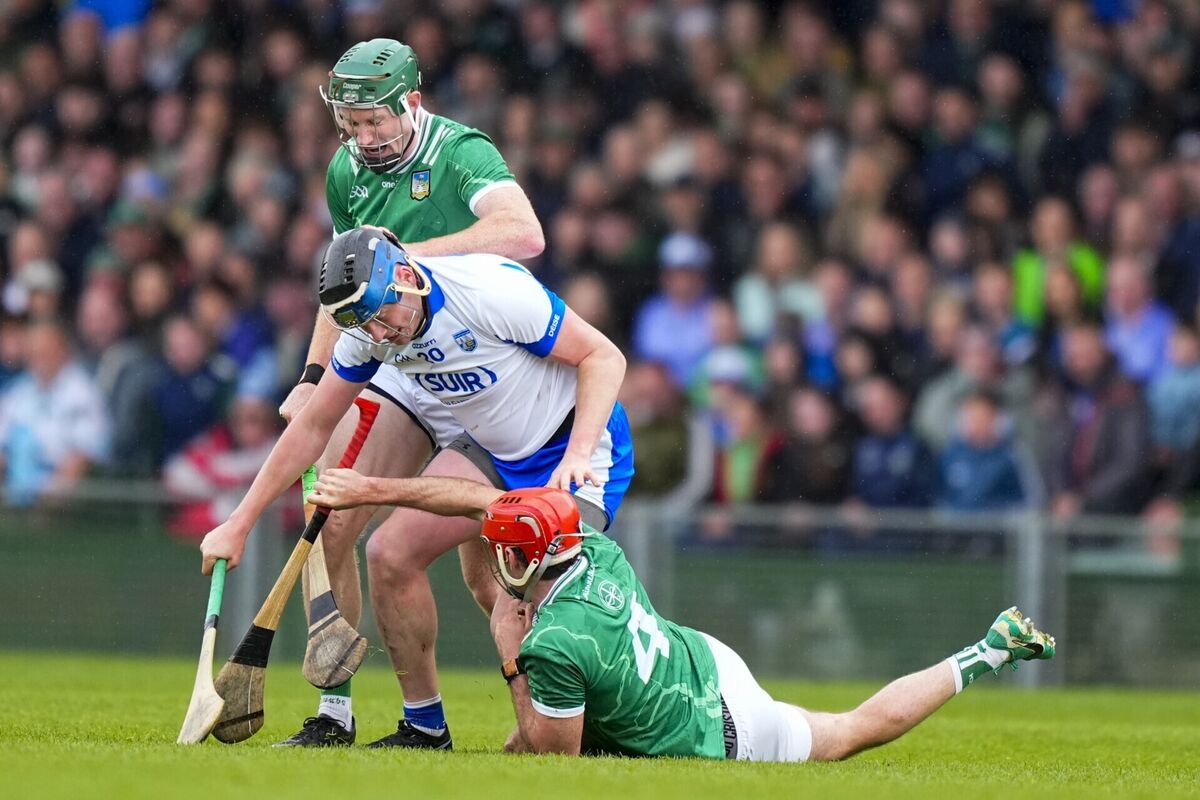 Austin Gleeson of Waterford tussles with Barry Nash of Limerick and William O'Donoghue of Limerick. Picture: ©INPHO/James Lawlor