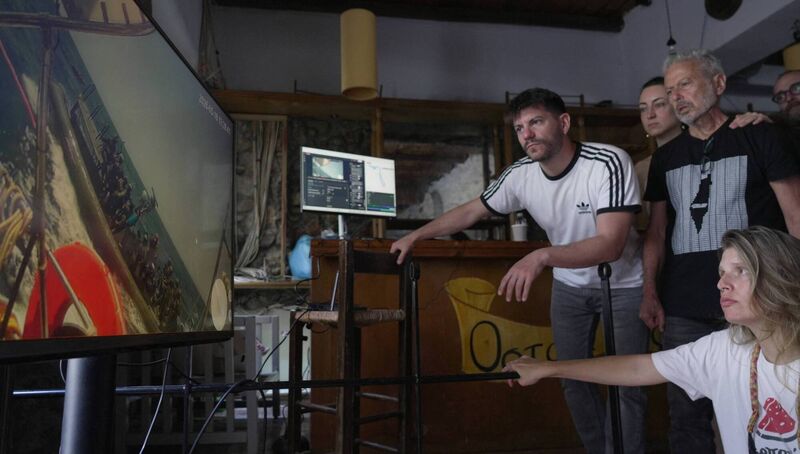 Gaza flotilla activists and supporters, monitoring video transmissions from the ships of the aid flotilla headed for Gaza, watch the interception in international waters of one of the boats. Picture: Angelos Tsatsis
