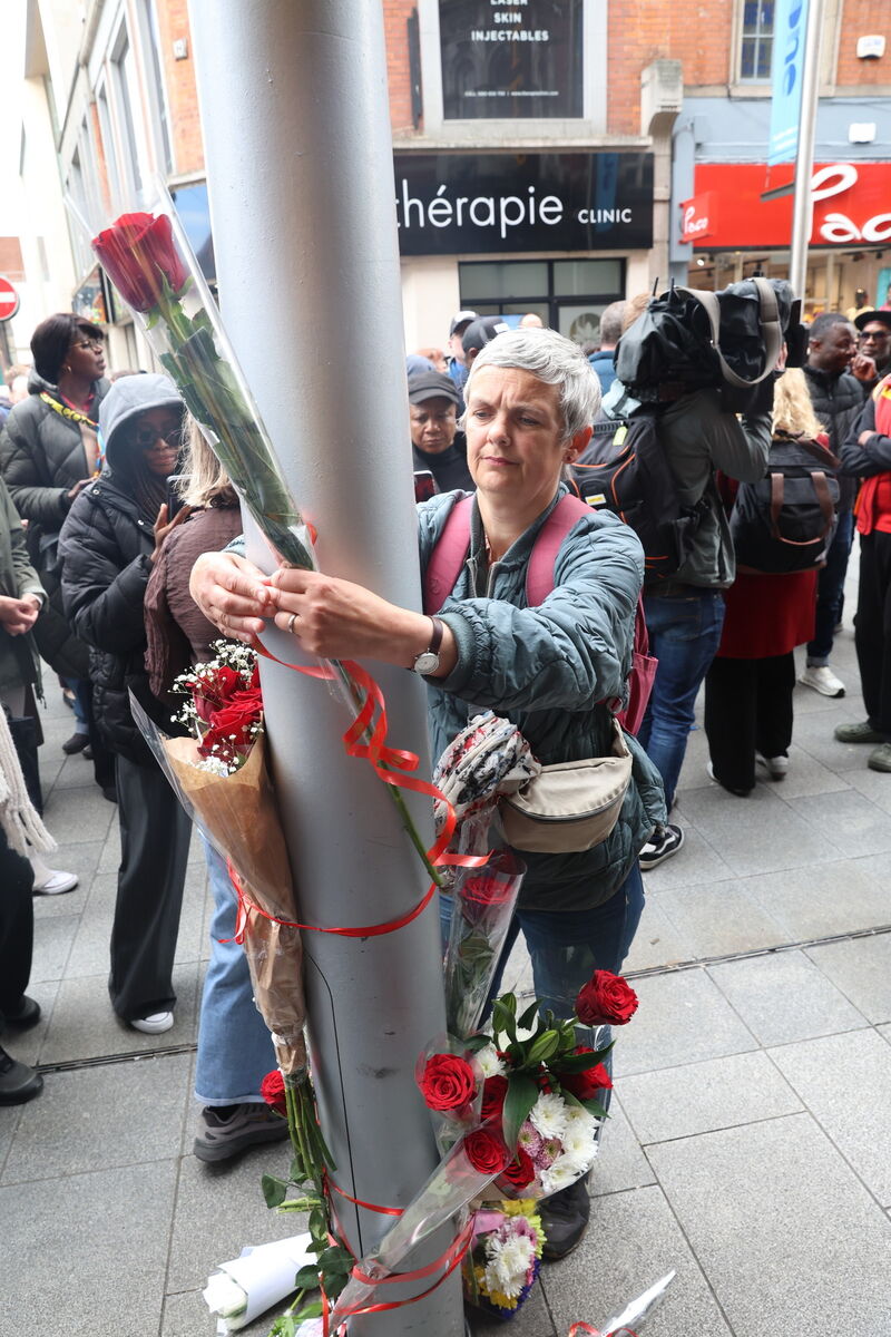 One of the people taking part in Tuesday's protest on Henry St in Dublin following the death of Congolese-born man Yves Sakila. Picture: Stephen Collins/Collins