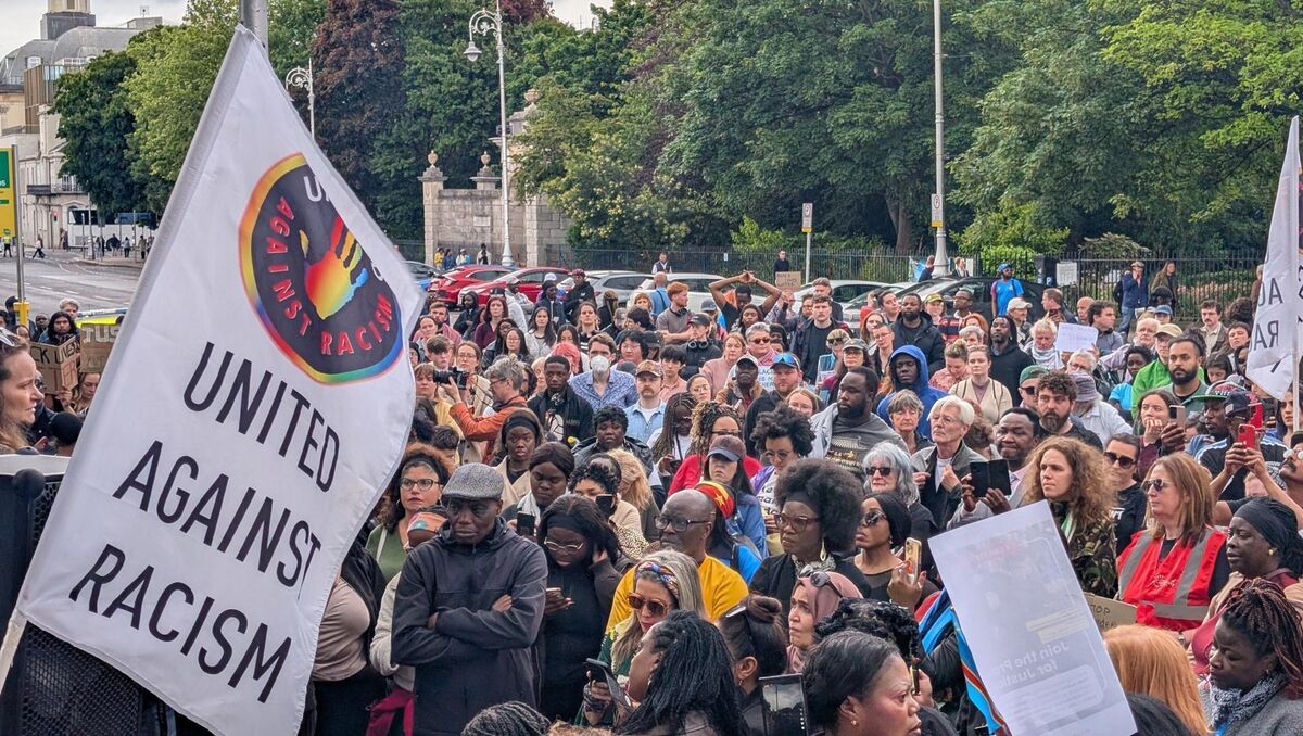 People taking part in a protest outside Leinster House, Dublin, over the death of Congolese man Yves Sakila. Picture:  Cillian Sherlock/PA