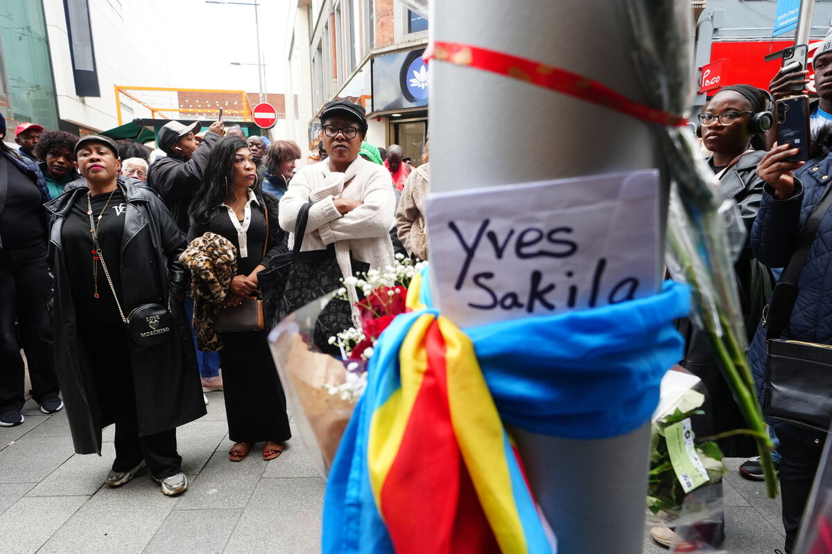 People attend a vigil for Yves Sakila on Henry Street, Dublin. Picture: PA