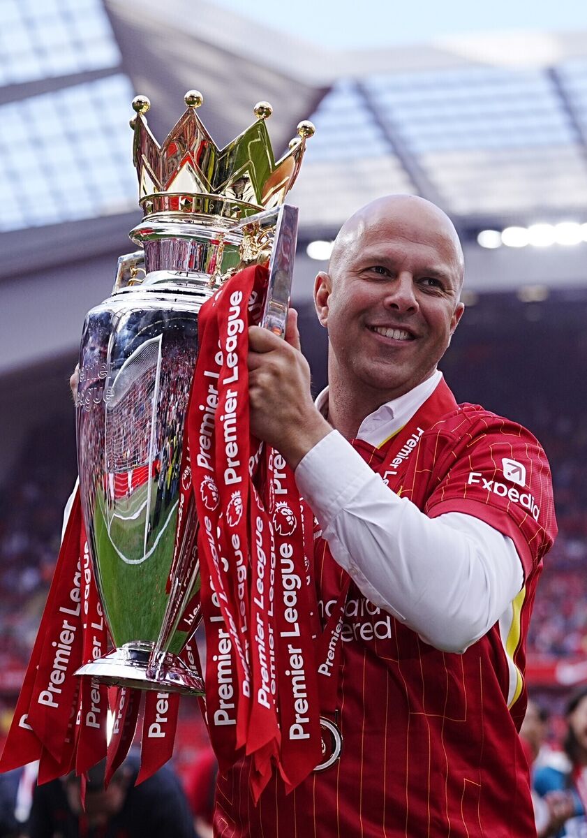 Arne Slot celebrates with the Premier League trophy after the Premier League match at Anfield, Liverpool. Picture: Peter Byrne/PA Wire