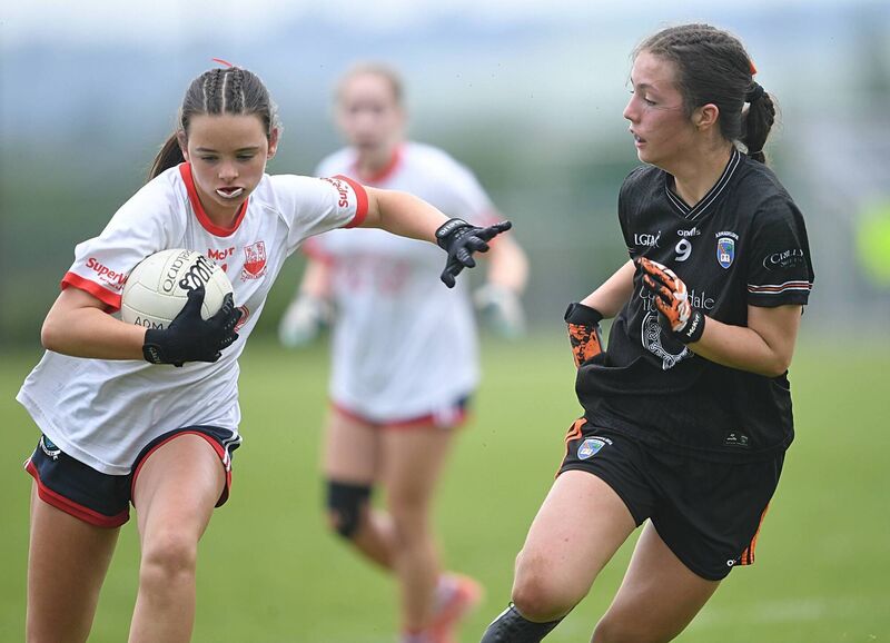 Beth Hegarty, Cork, holds off Saorlaith McParland, Armagh, in the U14 LGFA All-Ireland final. Picture: Gerard O’Loughlin
