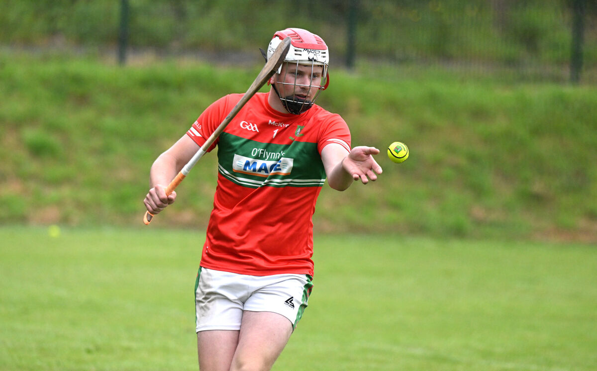  Goalkeeper Johnny Swayne drives a puckout for Fr O'Neill's. Picture: Larry Cummins