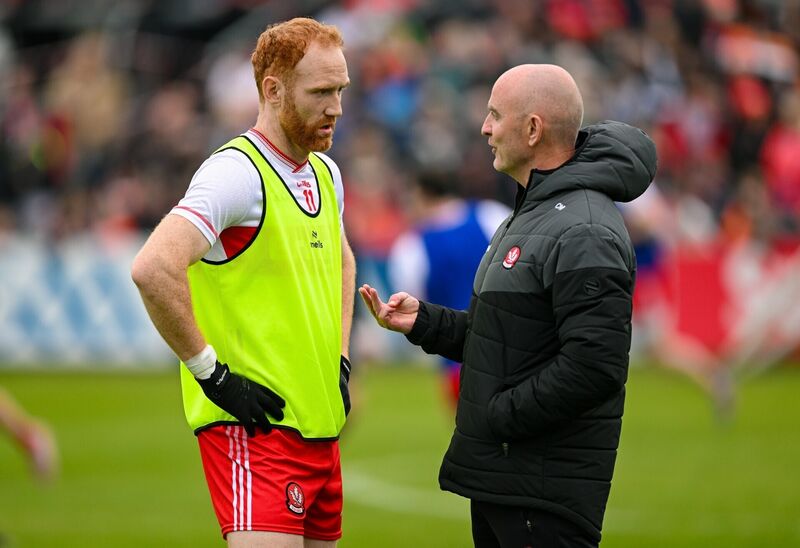 Derry manager Ciaran Meenagh in conversation with captain Conor Glass before their side's All-Ireland SFC round 1 game against Armagh. Pic: Ramsey Cardy/Sportsfile