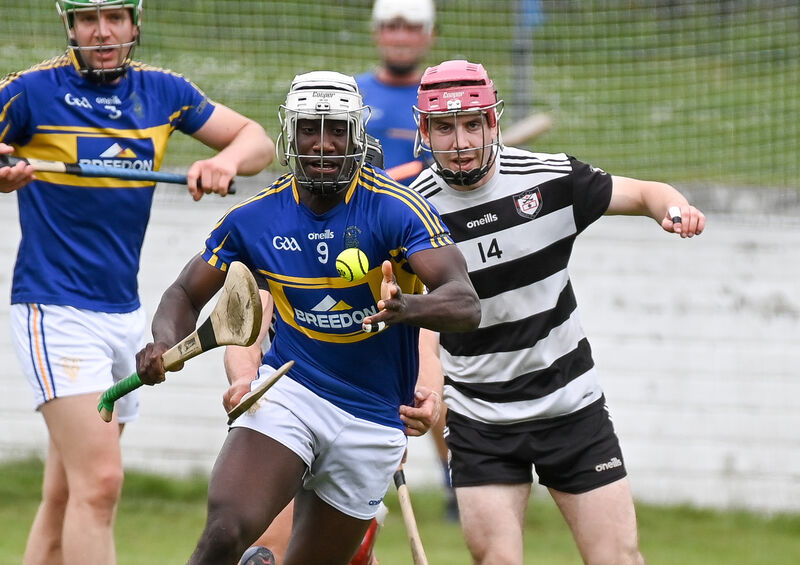 Carrigtwohill's Justin Oke tries to get away from Midleton's Alex Quirke. Picture: David Keane