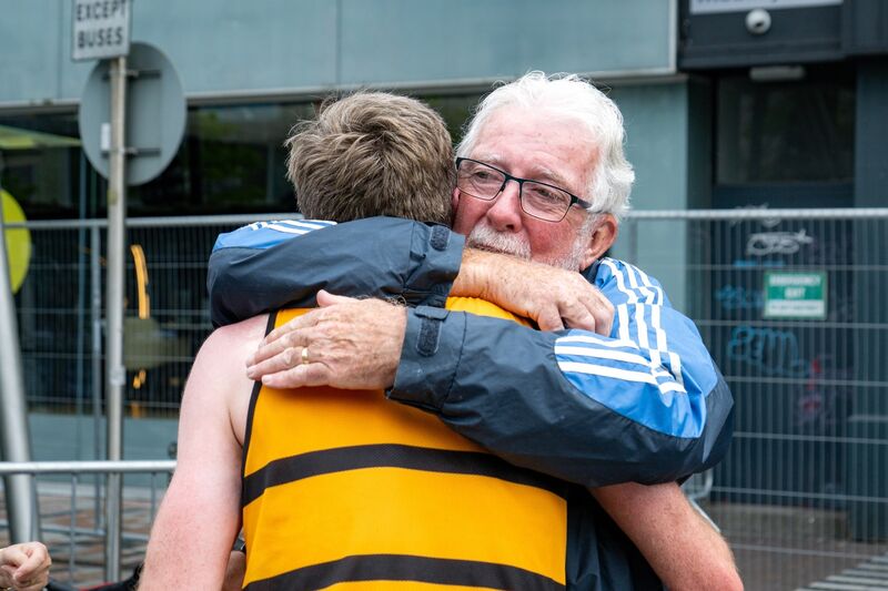Winner of the Half Marathon Ryan Creech receives an emotional hug from his father Eamonn. Picture: Chani Anderson