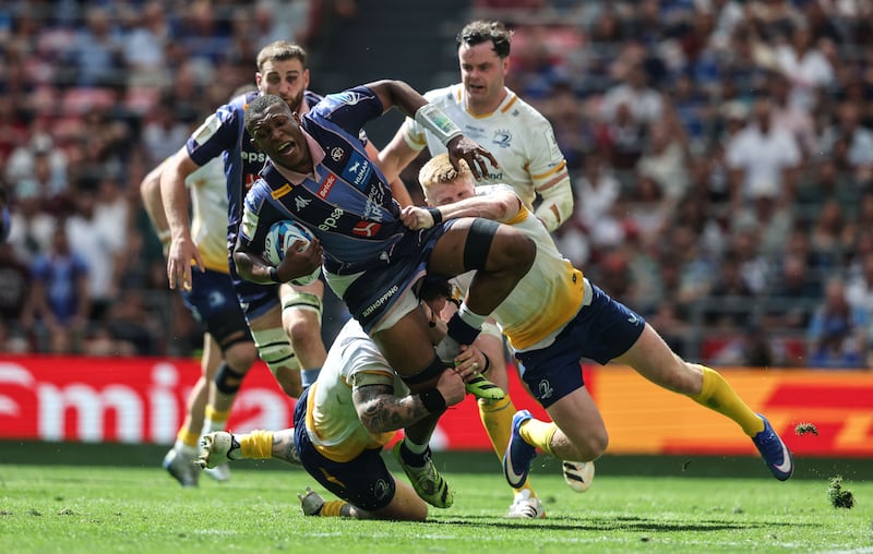 Union Bordeaux Bègles' Cameron Woki is tackled by Leinster's Andrew Porter and Tommy O'Brien in the Champions Cup final. Photograph: Dan Sheridan/Inpho