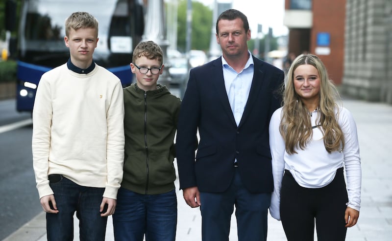 John O'Meara with his children Aoife, Jack and Tommy outside the Four Courts. File photograph: Collins Courts