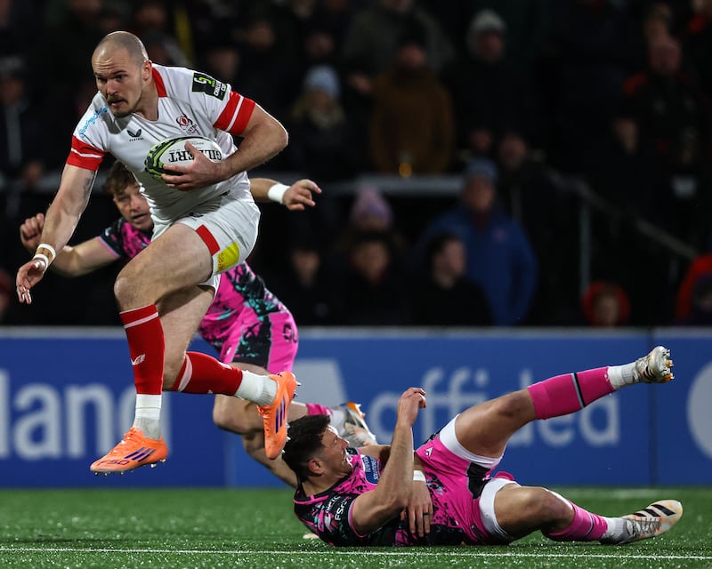 Ulster's Jacob Stockdale makes a break past Owen Watkin of Ospreys. Photograph: Ben Brady/Inpho