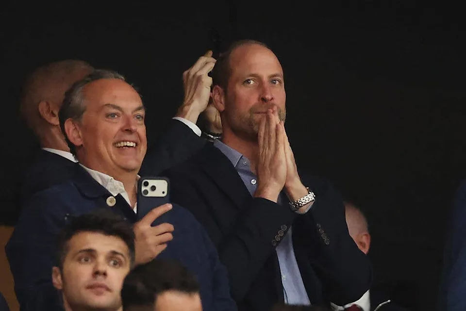 Prince William with his face behind his hands