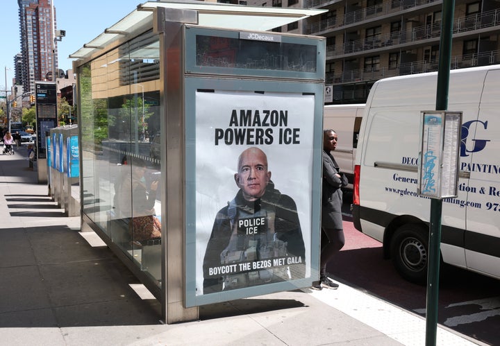 An "AMAZON POWERS ICE" poster is displayed at a bus stop in New York City's Manhattan borough last week.