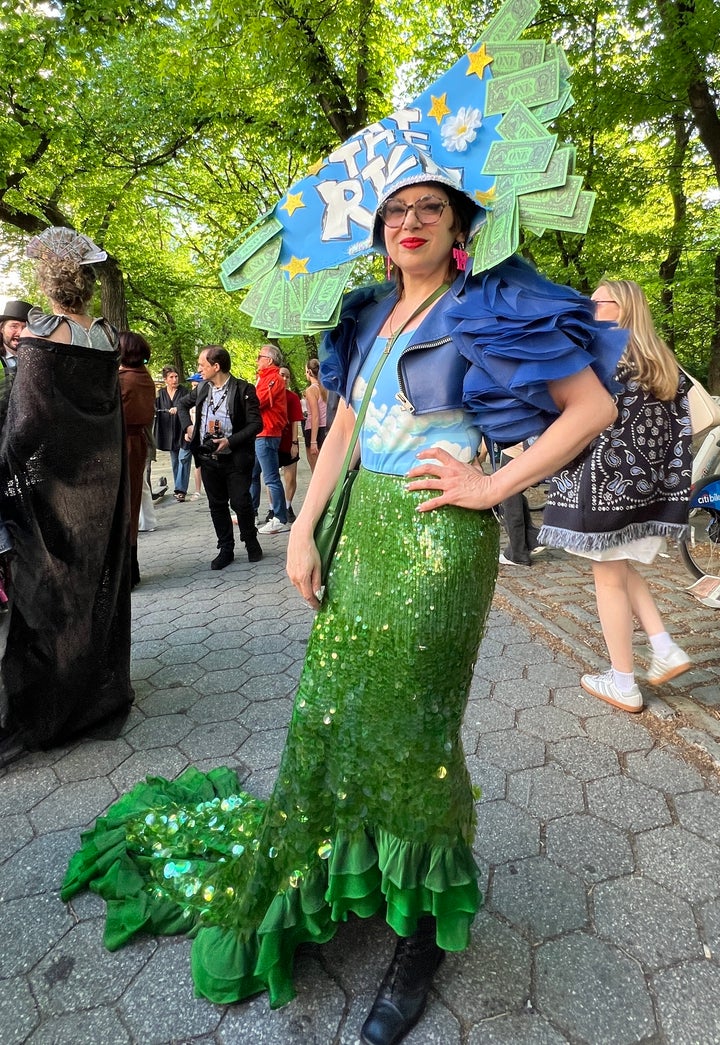 Wendy Brandes, 58, rocks a sparkly Mother Nature-inspired fit with paper headwear that reads "TAX THE RICH" just blocks from the steps of the Met.