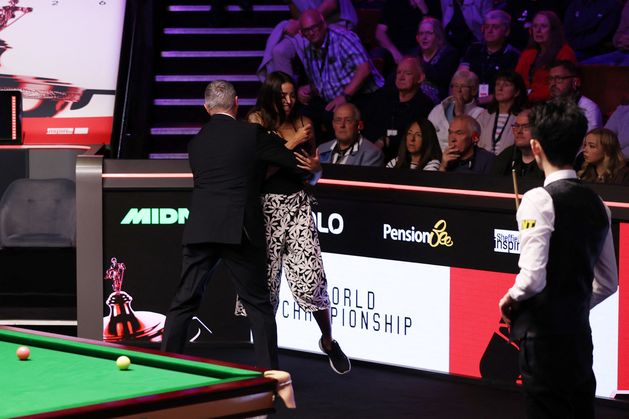 World Snooker Championship final: Female spectator physically ejected at a fractious Crucible as Wu Yize takes three-frame lead into Monday