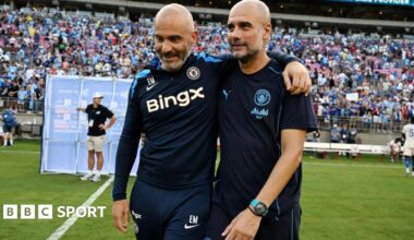 An image of Enzo Maresca, manager of Chelsea, and Pep Guardiola, manager of Man City embracing on the pitch.